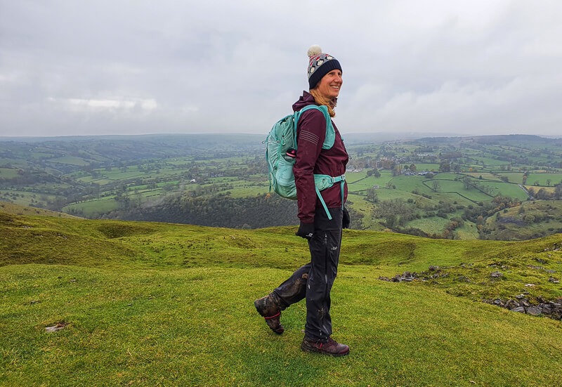 Becky walking on hill in Peak District