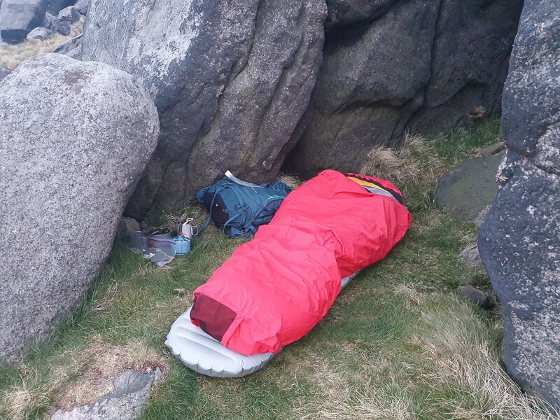 Bivvy bag in between rocks